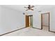 Bedroom with white carpet, doors to en suite bath, and white walls at 8 Rising Moon Trl, Ormond Beach, FL 32174