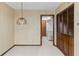 Open dining area leading to laundry room with folding doors at 8 Rising Moon Trl, Ormond Beach, FL 32174