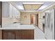 Bright kitchen featuring white cabinets, stainless steel appliances, and a functional layout at 8 Rising Moon Trl, Ormond Beach, FL 32174