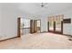 Cozy loft area with wood railing, and outdoor access to the patio at 8 Rising Moon Trl, Ormond Beach, FL 32174