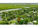 Aerial shot of a home surrounded by lush trees in a serene, green neighborhood at 812 Faulkner St, New Smyrna Beach, FL 32168