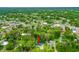 Aerial view of property with lush surrounding trees and close proximity to the river and shops at 812 Faulkner St, New Smyrna Beach, FL 32168