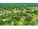 Aerial view of property with lush surrounding trees and close proximity to the river and shops at 812 Faulkner St, New Smyrna Beach, FL 32168