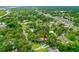 Aerial view of property with lush surrounding trees and close proximity to the river and shops at 812 Faulkner St, New Smyrna Beach, FL 32168