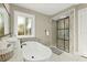 Modern bathroom featuring a standalone tub and a stylish glass-enclosed shower at 812 Faulkner St, New Smyrna Beach, FL 32168