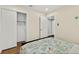 Well-lit bedroom with hardwood floors and a view of closet at 812 Faulkner St, New Smyrna Beach, FL 32168