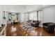 Inviting living room with hardwood floors, neutral decor, and plenty of natural light at 812 Faulkner St, New Smyrna Beach, FL 32168