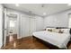 Spacious main bedroom with wood floors, white walls, recessed lights, and closet at 812 Faulkner St, New Smyrna Beach, FL 32168