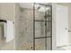 Stunning tiled shower with mosaic accents and a modern glass enclosure at 812 Faulkner St, New Smyrna Beach, FL 32168