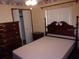 Cozy bedroom featuring classic wooden furniture, neutral walls, and ample natural light at 871 Oak Tree Ln, Lake Helen, FL 32744
