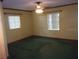 Carpeted bedroom with natural light and ceiling fan at 871 Oak Tree Ln, Lake Helen, FL 32744