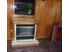 Living room fireplace with a wooden mantel and tiled floor at 871 Oak Tree Ln, Lake Helen, FL 32744