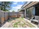 The backyard features a fence, some sparse plants and an air conditioning unit at 874 Commonwealth Ct, Casselberry, FL 32707