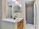 Well-lit bathroom with double sinks, vanity, and shower/tub combination at 874 Commonwealth Ct, Casselberry, FL 32707