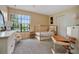 Well-lit bedroom features large windows, and an antique desk at 874 Commonwealth Ct, Casselberry, FL 32707