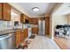 Bright kitchen with stainless steel appliances and oak cabinets at 874 Commonwealth Ct, Casselberry, FL 32707