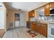 Efficient laundry closet offers convenient in-kitchen access, and ample storage space at 874 Commonwealth Ct, Casselberry, FL 32707