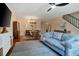 A well-lit living room adjacent to the dining area showcases the spaciousness of the home at 874 Commonwealth Ct, Casselberry, FL 32707