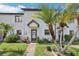 Charming townhome featuring mature landscaping and inviting front entrance at 903 Deer Springs Rd, Port Orange, FL 32129