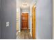 Hallway with wooden flooring, and entrance to the kitchen at 903 Deer Springs Rd, Port Orange, FL 32129