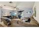 Comfortable living room with couch, ceiling fan, and lots of natural light at 903 Deer Springs Rd, Port Orange, FL 32129
