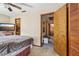 Bedroom view showcasing a comfortable interior, a door to the laundry room and ample closet space at 903 Deer Springs Rd, Port Orange, FL 32129