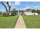 Community pool house in The Hammocks neighborhood surrounded by green grass at 903 Deer Springs Rd, Port Orange, FL 32129