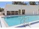 Community swimming pool with secure access, clear water, and pool ladder at 903 Deer Springs Rd, Port Orange, FL 32129