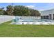 Community swimming pool with tables and sun loungers and a grassy lawn area at 903 Deer Springs Rd, Port Orange, FL 32129