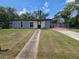Charming single-story home with a covered carport and walkway to the front door at 922 Saxon Blvd, Deltona, FL 32725