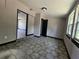 Open-concept living room boasting tile floors, neutral paint and natural light at 922 Saxon Blvd, Deltona, FL 32725