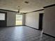 Inviting living room featuring tile floors, ceiling fan, and natural light at 922 Saxon Blvd, Deltona, FL 32725