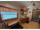 Eat-in kitchen features a small table, tiled floors, and practical finishes at 942 Lemon Bluff Rd, Osteen, FL 32764