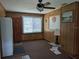 Functional room with wood paneling, a ceiling fan, and lots of natural light at 942 Lemon Bluff Rd, Osteen, FL 32764