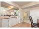 Mirrored bar area with wood counters and white cabinetry near the entrance at 961 S Lakewood Ter # C, Port Orange, FL 32127