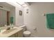 Neutral bathroom with a single sink vanity, toilet, and shower with curtain at 961 S Lakewood Ter # C, Port Orange, FL 32127