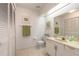 Bright bathroom featuring white cabinets and tile floors at 961 S Lakewood Ter # C, Port Orange, FL 32127
