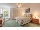 This bedroom has a large closet, ceiling fan, and natural lighting at 961 S Lakewood Ter # C, Port Orange, FL 32127