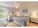Cozy bedroom with neutral tones, wood floors, and ample natural light at 961 S Lakewood Ter # C, Port Orange, FL 32127