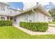 Charming home exterior with well-manicured lawn and attached two-car garage at 961 S Lakewood Ter # C, Port Orange, FL 32127