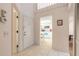 Open foyer with high ceilings, tile flooring, and a view of the kitchen at 961 S Lakewood Ter # C, Port Orange, FL 32127