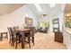 Spacious living room with vaulted ceilings, fireplace, and wood-look flooring at 961 S Lakewood Ter # C, Port Orange, FL 32127