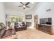 Comfortable living area with a fireplace and sliding glass doors to the backyard at 961 S Lakewood Ter # C, Port Orange, FL 32127