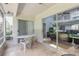 Enjoy the outdoors from this screened patio with sliding doors, perfect for relaxing or entertaining guests at 961 S Lakewood Ter # C, Port Orange, FL 32127