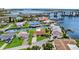 Aerial view capturing a waterfront home with dock and bridge access to beautiful waterways at 10 Venetian Cir, Port Orange, FL 32127