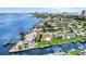 Waterfront homes with private docks and boat lifts on a canal near the beach and city at 10 Venetian Cir, Port Orange, FL 32127