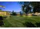 Lush backyard leading to waterfront docks and canal access, perfect for relaxation and entertainment at 10 Venetian Cir, Port Orange, FL 32127