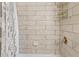 Shower wall features neutral tile and a mounted soap dish and a metal wire rack at 10 Venetian Cir, Port Orange, FL 32127