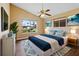 Comfortable bedroom with plenty of natural light and a ceiling fan at 10 Venetian Cir, Port Orange, FL 32127
