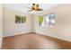 Bedroom featuring hardwood floors, a ceiling fan, and lots of natural light at 10 Venetian Cir, Port Orange, FL 32127